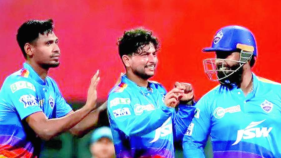 Kuldeep Yadav (second from left) celebrates with teammates at the Wankhede on Thursday.