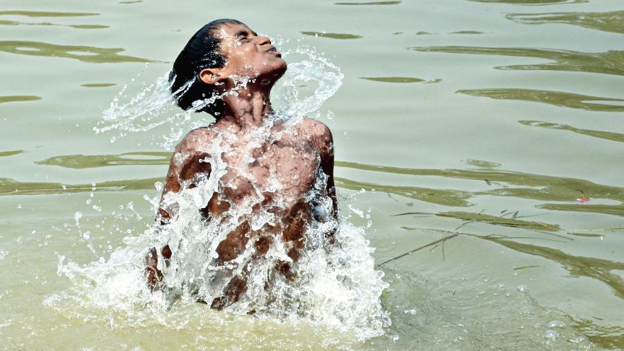 A boy takes a dip in a canal on the outskirts of Amritsar to get some relief from the heat wave. After the hottest March in a century, many states are recording temperatures that are several degrees above normal.