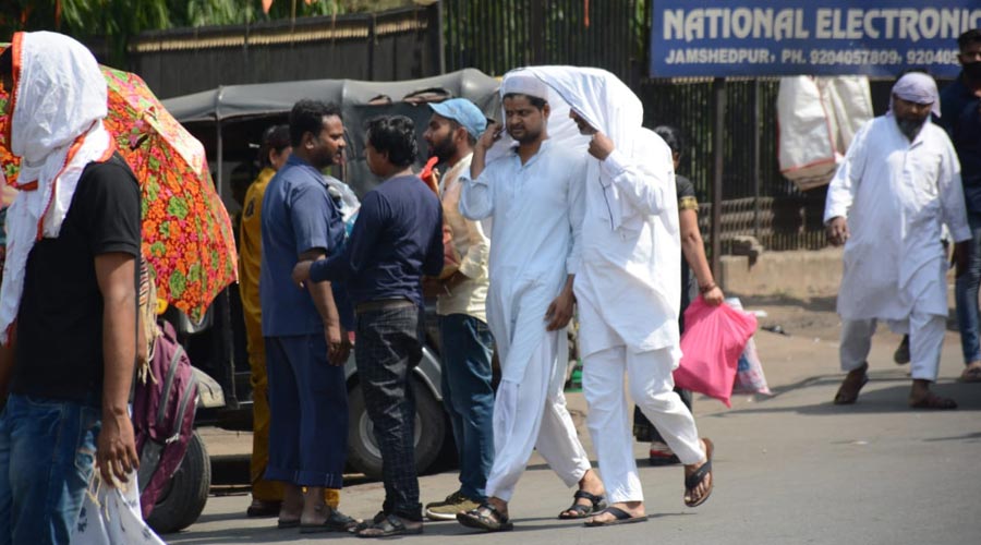 Commuters brave the scorching heat in Jamshedpur on Friday.