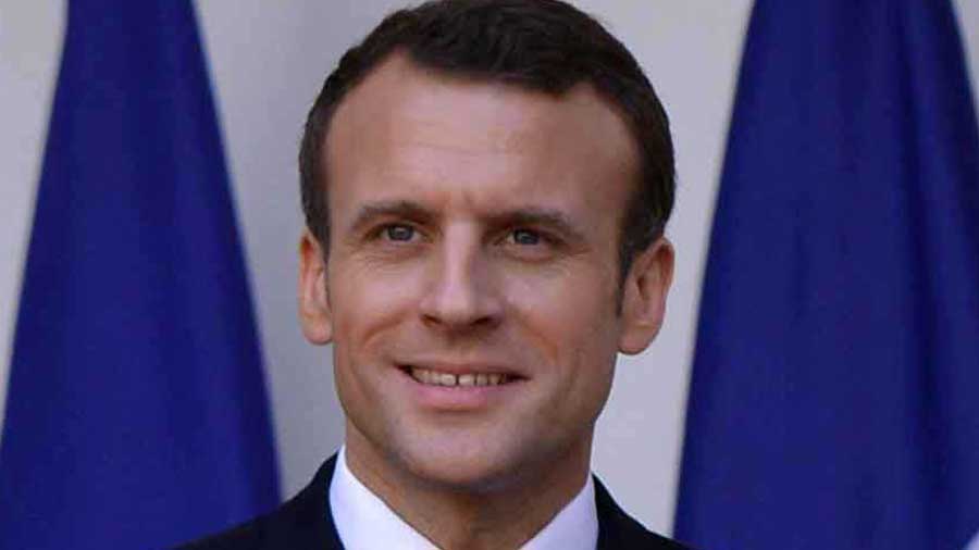 Emmanuel Macron invokes French footballer Kylian Mbappe to describe how he is neither a left winger nor a right winger but someone who likes to operate in the centre