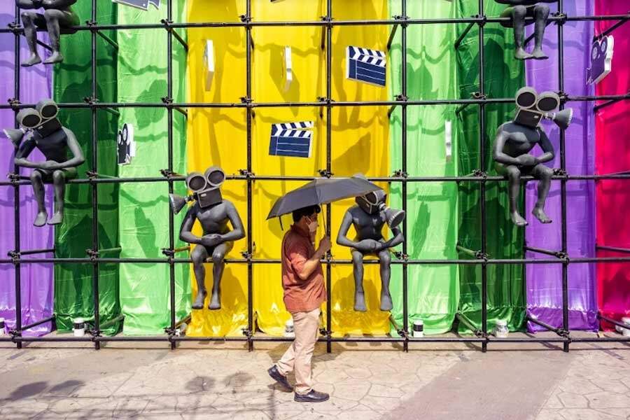ALL EYES ON KIFF: A man walks past an installation built on the occasion of the Kolkata International Film Festival at Nandan on Tuesday, April 26