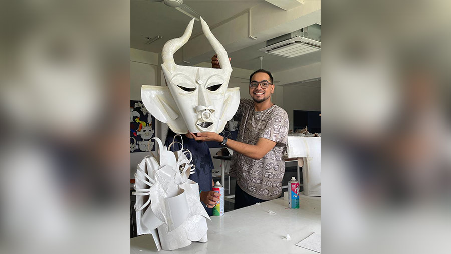 Sumit Sarkar, assistant professor, World University of Design, displays a mask at his workshop. 