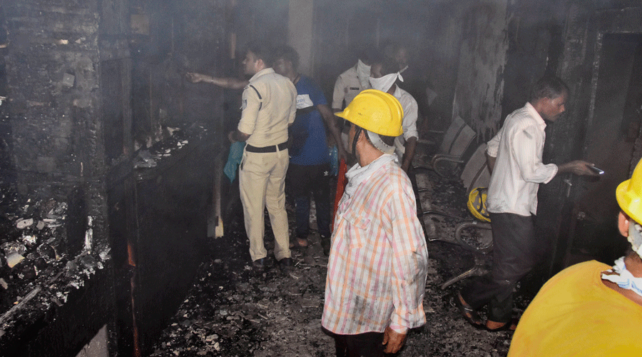 Police and fire personnel investigate at New Life Multi-speciality Hospital in Jabalpur on Monday.