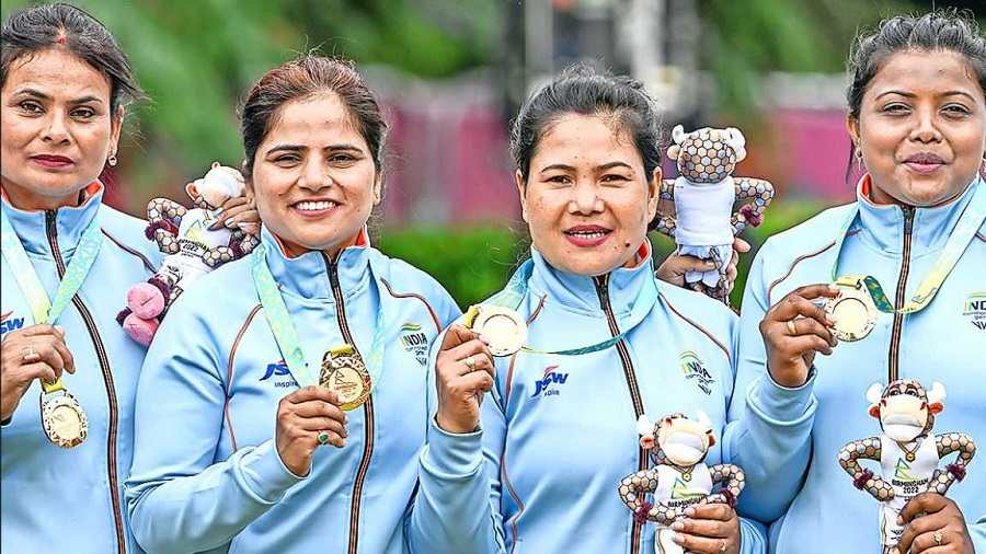 Lawn bowls women’s fours team of (from left) Lovely Choubey, Pinki, Nayanmoni Saikia and Rupa Rani Tirkey show their medals in Birmingham.