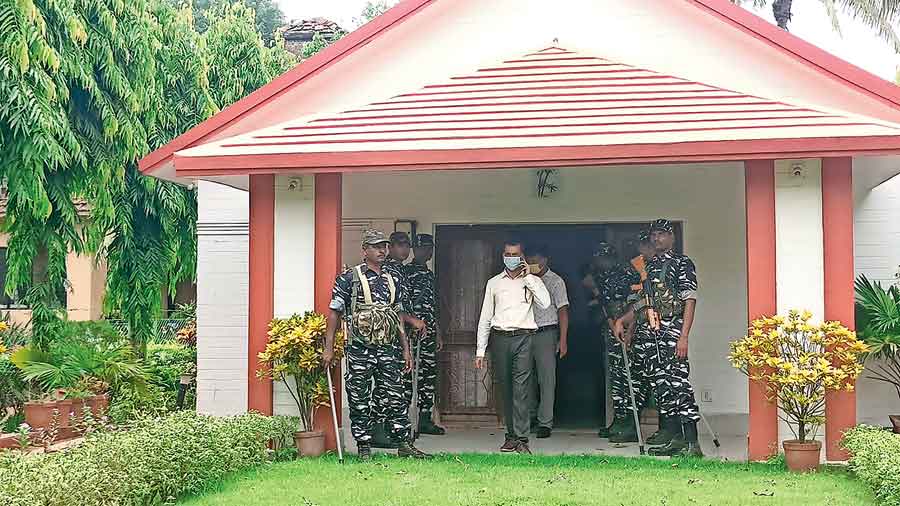 Security personnel at the house in Santiniketan during the ED raid on Wednesday. 