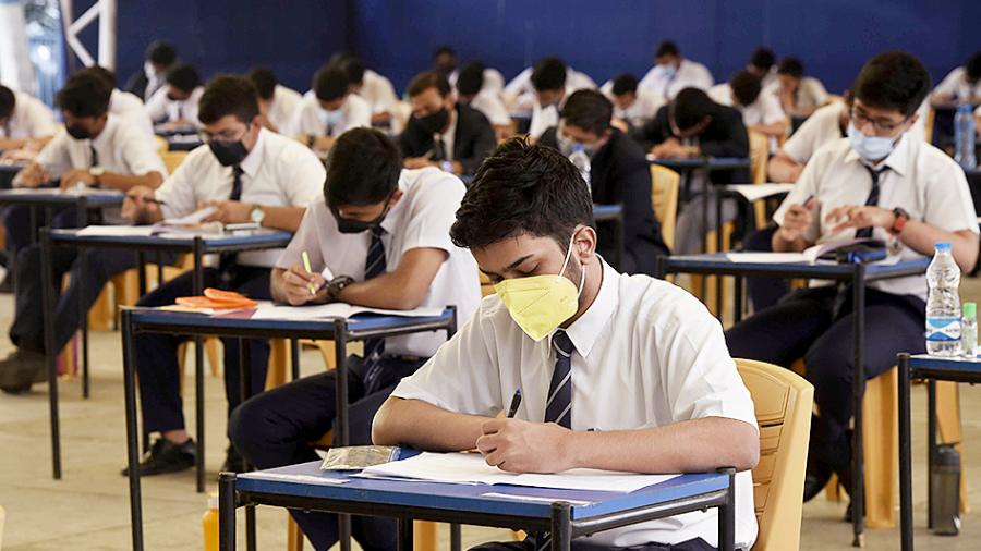 Picture of students writing their ISC board exams