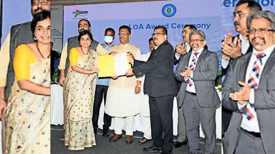Firhad Hakim hands over the letter of award (LoA) to Tata Motors officials on Wednesday