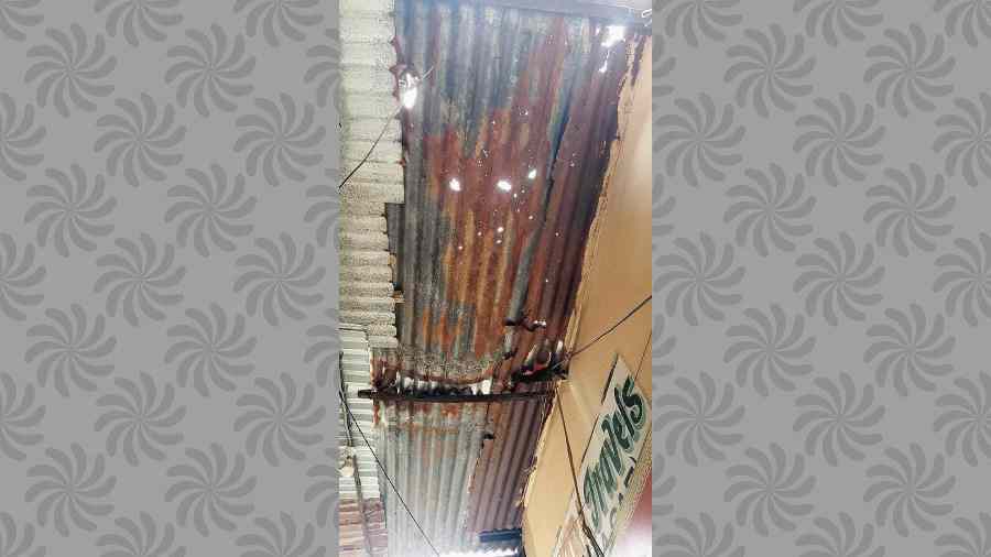 Rusted and leaking tin roofs at CE Market. 