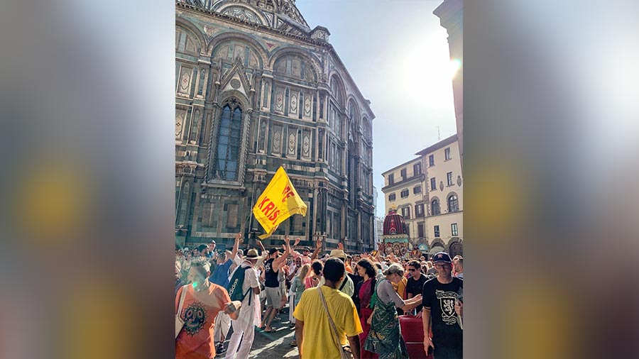 A Rath Yatra procession in Florence with the Cathedral of Santa Maria del Fiore in the background