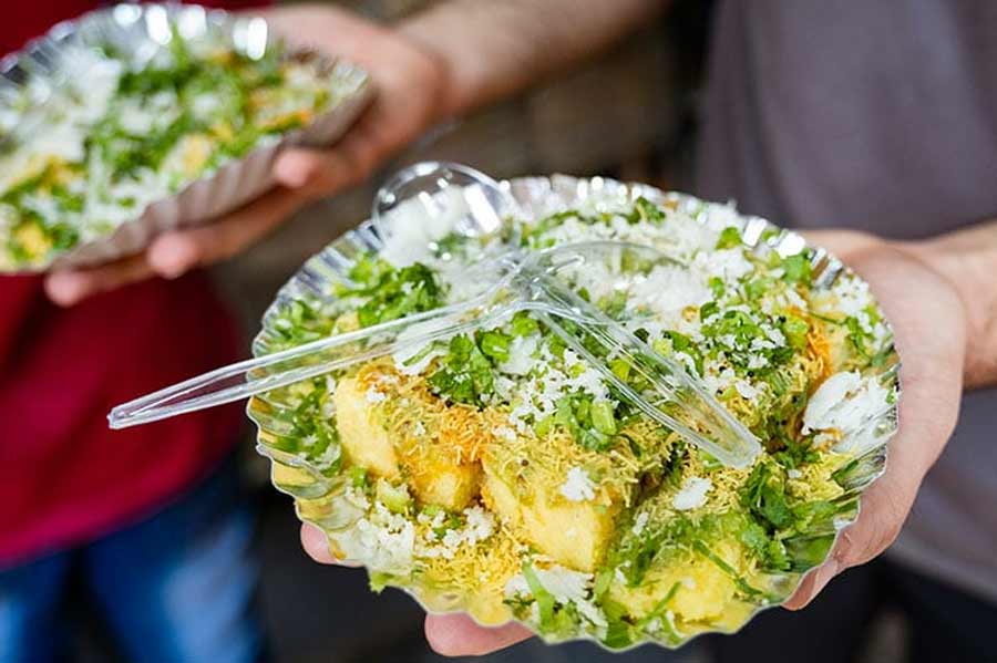 5. DHOKLA CHAAT FROM ANNARAS: The Dhokla Chaat at Annaras is an original concoction. The Naygandhis, the owners of the shop, top their fluffy dhoklas with a medley of coriander, coconut shavings, lime and a fistful of sev to make a scrumptious snack. If you love papri chaat and bhelpuri, give this a try! 