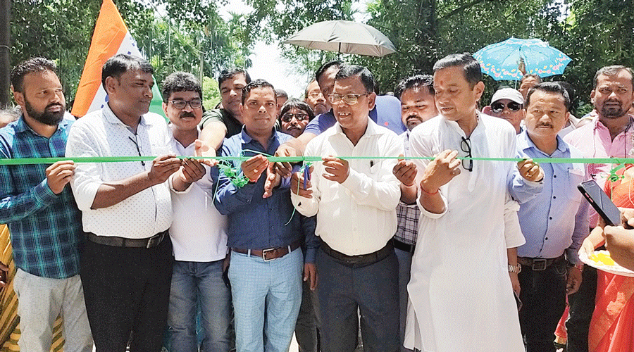 Minister Bulu Chik Baraik (wearing spectacles)  during the reopening of the Dharanipur tea garden  on Friday.