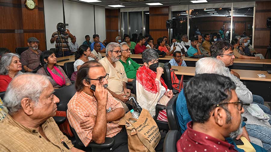 The attendees listen in rapt attention. 