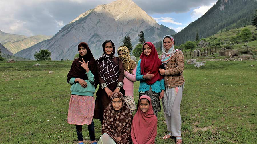 Rubina (extreme right) and the girls pose for a picture against the backdrop of Habba Khatun peak