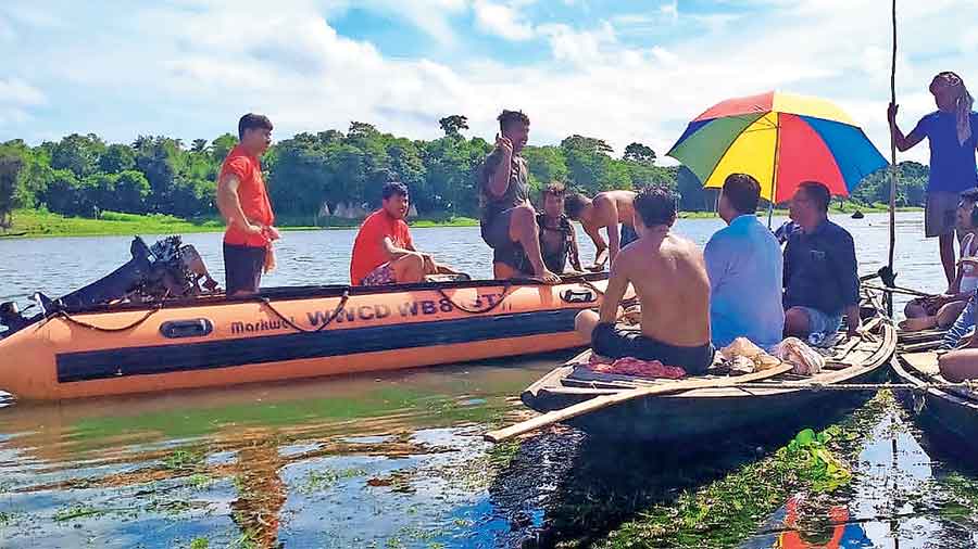 Rescuers try to trace the missing tourist in the Chupi lake on Sunday morning.