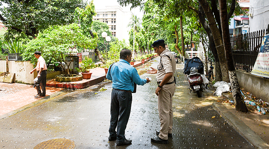A CISF officer checks an employee’s ID at the Indian Museum on Monday.