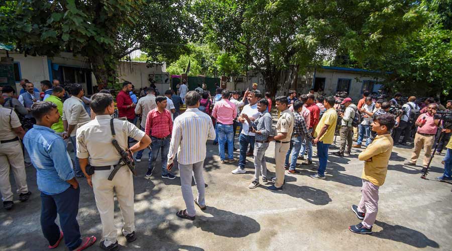 Media persons and supporters outside RJD senior leader Rabri Devis residence before party legislators meeting, in Patna, Tuesday