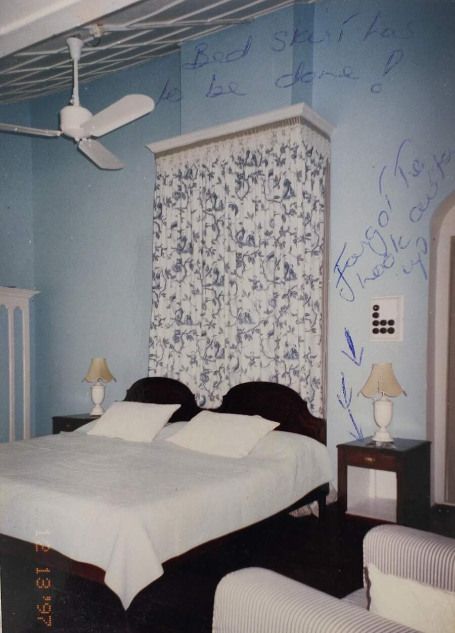 An album photo of the interiors of a guest room, with hand-written notes about the bed skirting and curtain hooks. "This is how we would communicate when Bronwyn was in Delhi and I was on site," says Husna-Tara