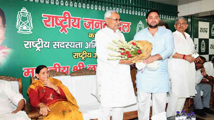 Nitish being greeted by Tejashwi as Rabri Devi looks on in Patna on Tuesday. 