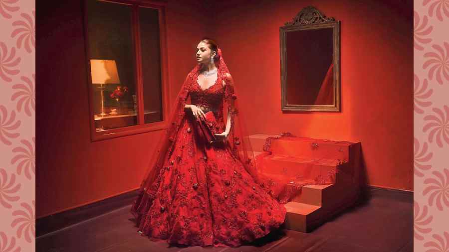 This frame looks straight out of a Karan Johar movie poster. The romantic and quintessential red comes alive in The Lady Anne Lehnga. “This embroidery is inspired from frescoes and we have tried it for the first time. The 3D flowers are inspired from jewellery as if you are wearing pieces of jewellery on the lehnga,” says Eshaani.