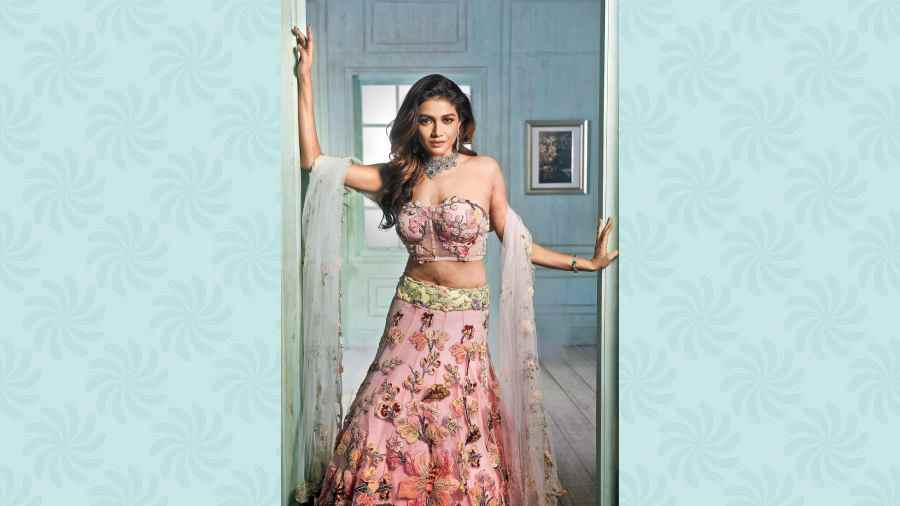 The Lady Iris Lehnga with tulle and floral applique has a canvas feel. Pretty and elegant.