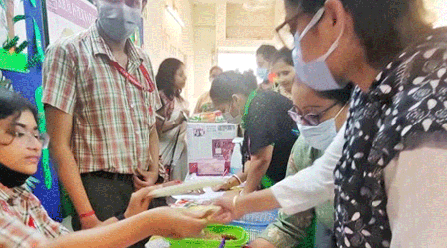 Students sell paper bags to parents.