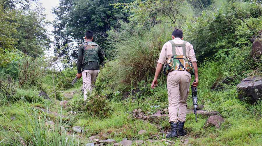 Security personnel near the encounter site after a suicide attack bid at an army camp in Darhal area of Rajouri, J&K on Thursday.