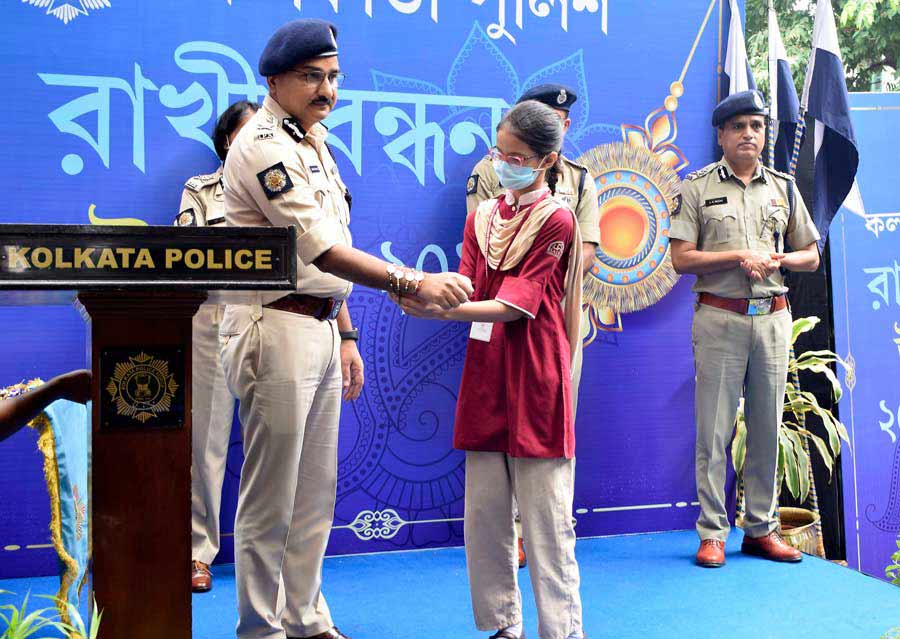A girl ties a rakhi on Kolkata police commissioner Vineet Kumar Goyal’s wrist at an event on Thursday. The event was organised by Kolkata police to celebrate the occasion of Raksha Bandhan.