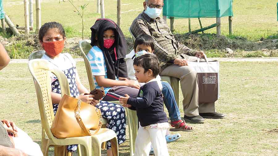 What is the child thinking looking at the bag?