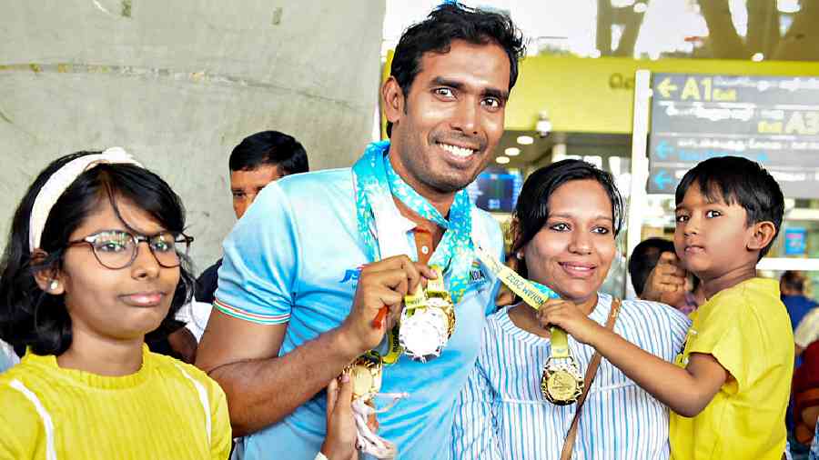 Table tennis star Sharath Kamal, who won three gold and a silver at the Commonwealth Games, with wife Sripoorni, daughter Suyasha and son Tejas at the Chennai airport on Thursday.