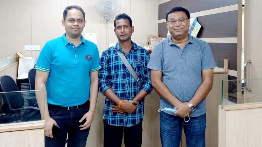 Salim Zafar of Biswa Bangla Marketing Corporation, cheese maker Palash Ghosh (centre) and Saurav Gupta of The Whole Hog Deli