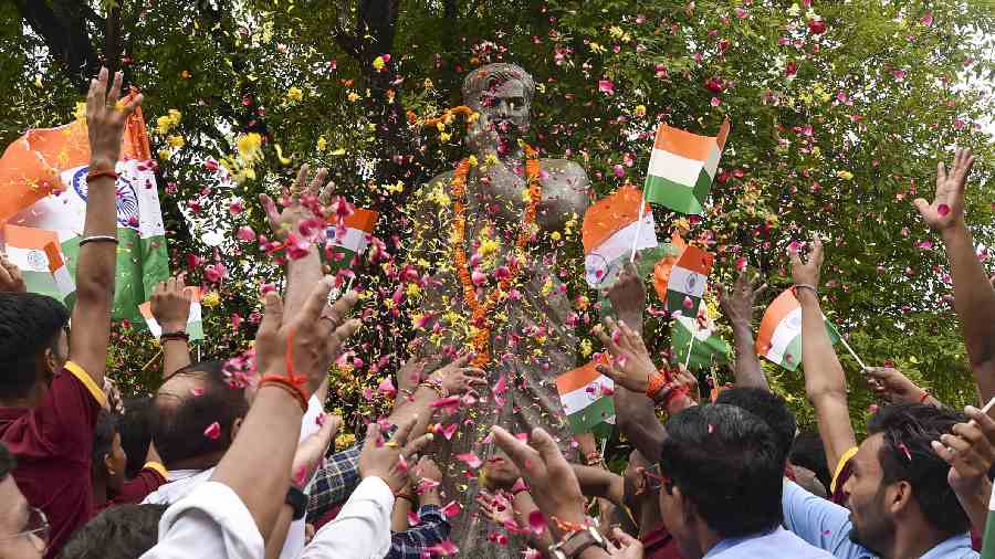 People pay floral tribute to freedom fighter Chandra Shekhar Azad on the occasion of 75th Independence Day, at Azad Park in Prayagraj. 