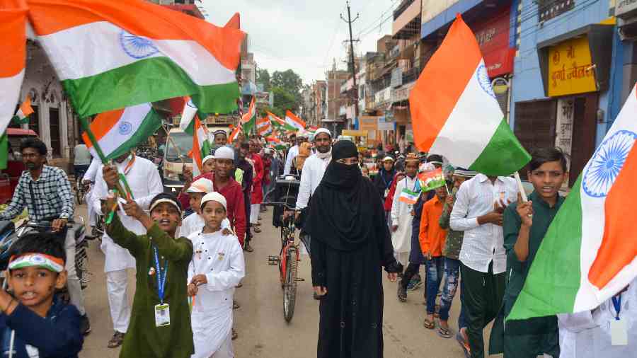 Students of Madarsa Arbiya take part in a Tiranga Yatra on the occasion of the 75th Independence Day celebrations in Mirzapur. 