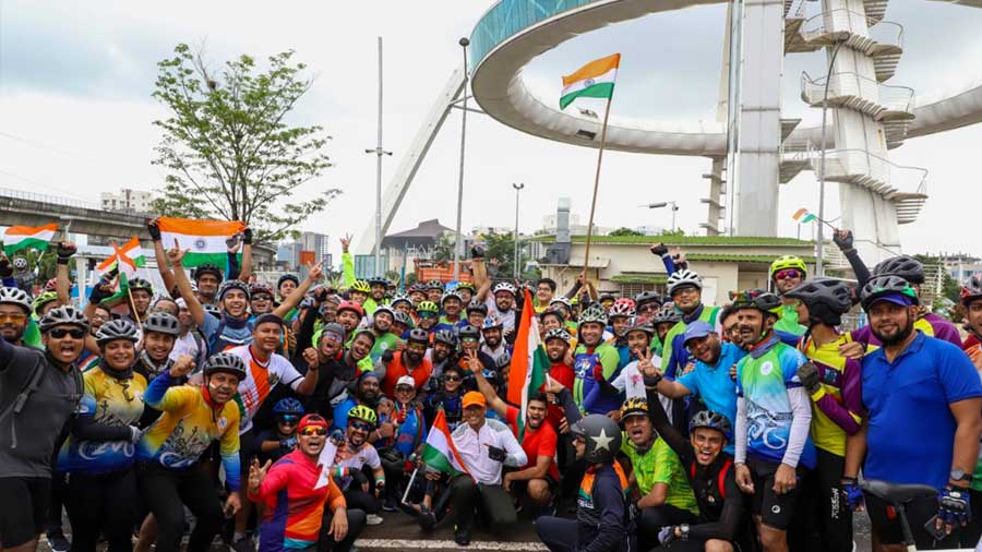 CNG riders celebrate a successful ride at the finish point, Biswa Bangla Gate