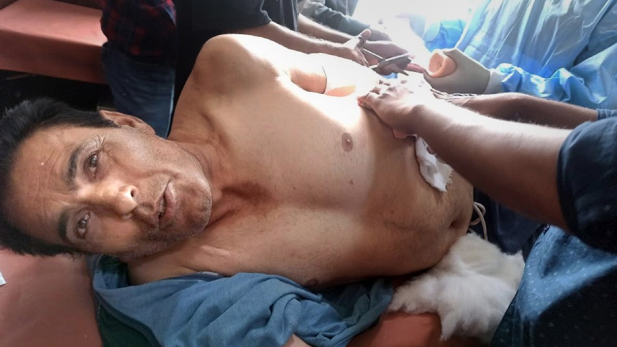 Pintu Kumar, a Kashmiri Pandit who was shot at by militants, being treated at a hospital, in J&K's Shopian district
