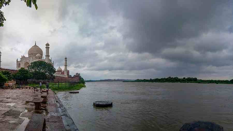 A swollen Yamuna river as its water level remains high owing to monsoon rains upstream, near the Taj Mahal, in Agra on Tuesday
