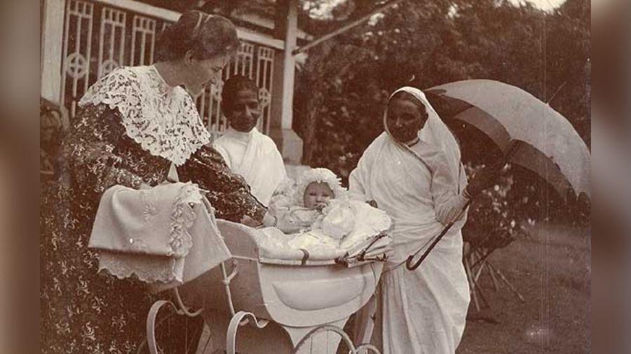 A lady with her child and servants, early 1900s