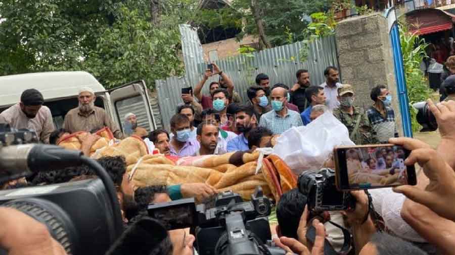 The body of Sunil Kumar Bhat being taken for cremation