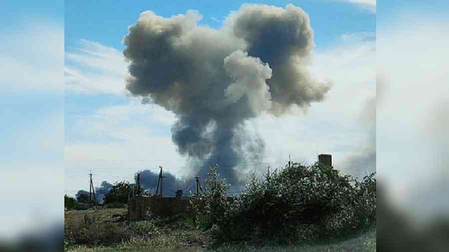 Smoke rises after explosions near Novofedorivka, Crimea.