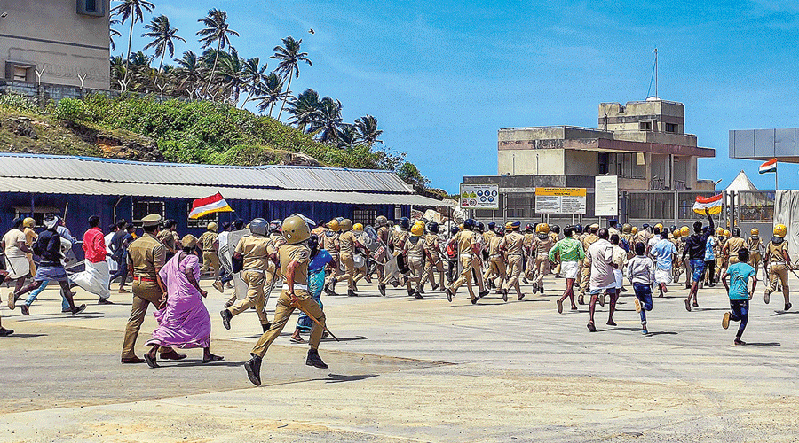 Police try to disperse the protesters at the Adanis’ port  project in Thiruvananthapuram on Friday.