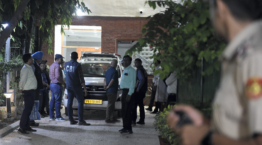 Central Bureau of Investigation officials leave after a raid at the residence of Delhi Deputy Chief Minister Manish Sisodia in connection with alleged irregularities in Delhi Excise Policy in New Delhi on Friday.