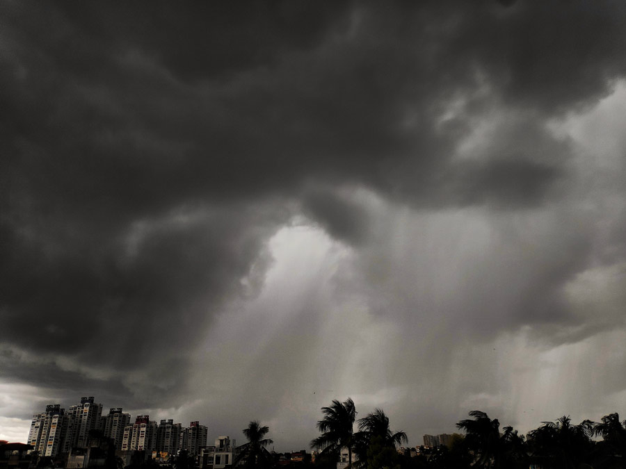 Dark clouds dot the skyline in south Kolkata on Friday. Intermittent showers drenched the city all day long as a deep depression moved into West Bengal from the Bay of Bengal in the evening.