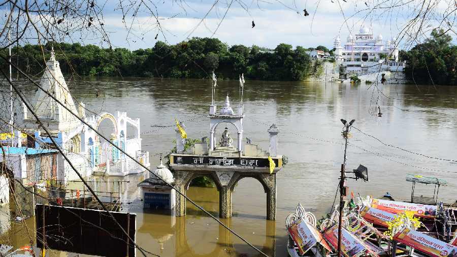 A temple is partially submerged in floodwater following an increase in the water level of Narmada river in Jabalpur