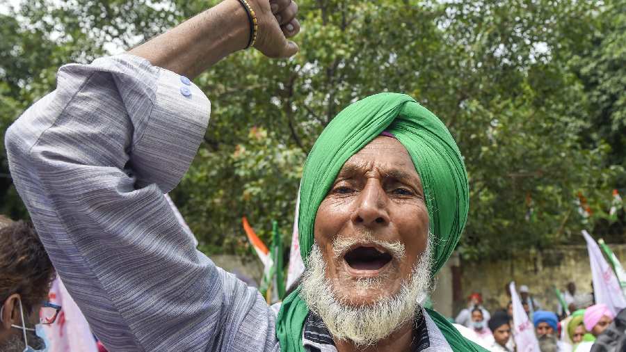 A farmer raises slogans
