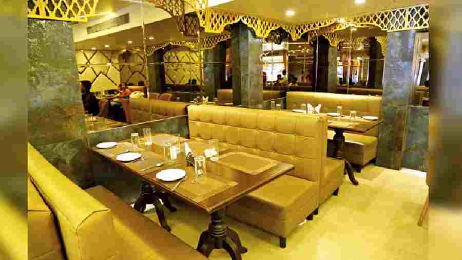 The 86-seater eatery is decorated in rich hues of gold and black with a touch of grey. Mughal architecture-inspired jaali design adorn its walls. The warm lighting makes it a comfortable set-up for a sit-down meal. 