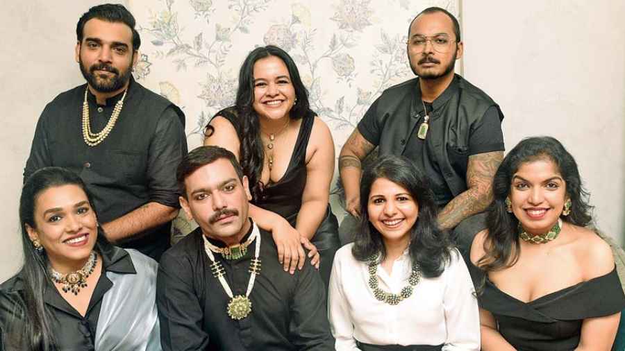 (L-R back row) Rohan Arora wore a unisex piece that is the brand’s modern take on traditional polki lines; Shabba Hakim in a layered single large polki piece that is perfect for pairing with western outfits; Arnesh Ghose accessorised the simple black shirt with a polki hexagon pendant. (L-R front row) Rimi Nayak paired a blue-enameled choker and traditional studs with the classic sari look; Ayushman Mitra accessorised the black-&-white look with a two-piece layered style by combining the pearl and green stone-studded choker and a polki piece strung with beads; Harshita Sultania in a statement traditional polki piece designed with green meena work, paired with a smart shirt look; and Urvika Kanoi accentuated her off-shoulder outfit with a polki and stones choker in a beautiful shade of light green.