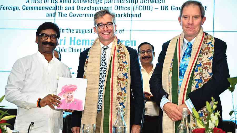British High Commissioner to India  Alex Ellis presents a book to Hemant Soren during the signing of the MoU  at Ranchi on Tuesday. 
