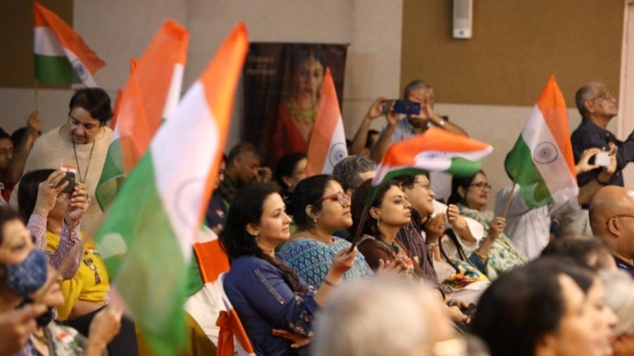 The audience waves the Tricolour during the concert