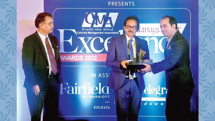 Satyam Roychowdhury(centre) receiving the Business Leadership Award from Abhishek Sachdev, general manger, Fairfield by Marriott(left) and T.V.S. Shenoy(right)
