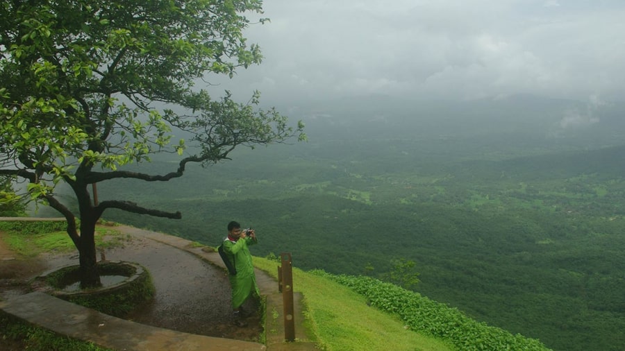 Rolling hills, green valleys and floating clouds, as seen from the Mahadevgad Point 