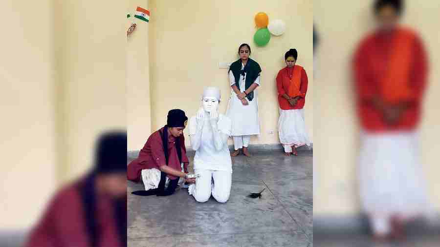 Students of National Skill Training Institute for Women take part in a skit on national integration. 